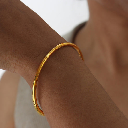 Timeless Elegance: The Simple Gold Bangle